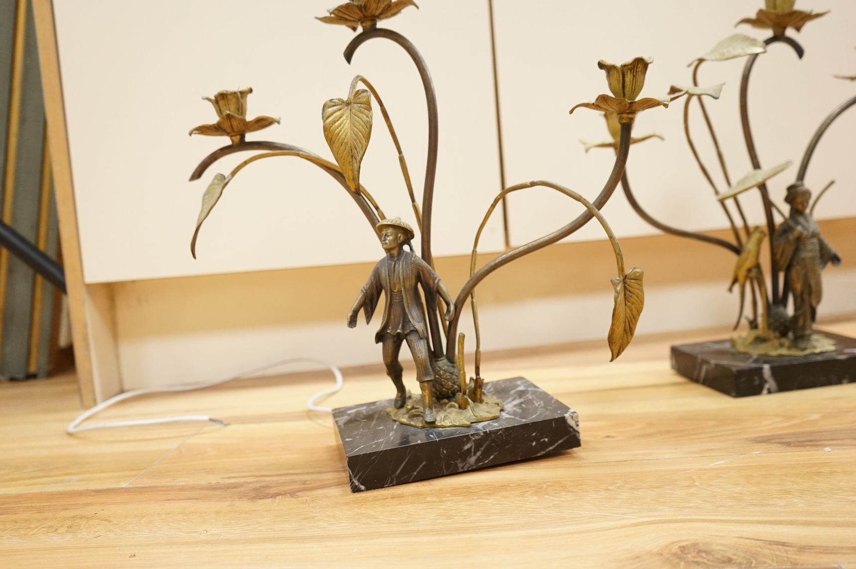 A pair of gilt metal and marble figural converted lamps, 38cm